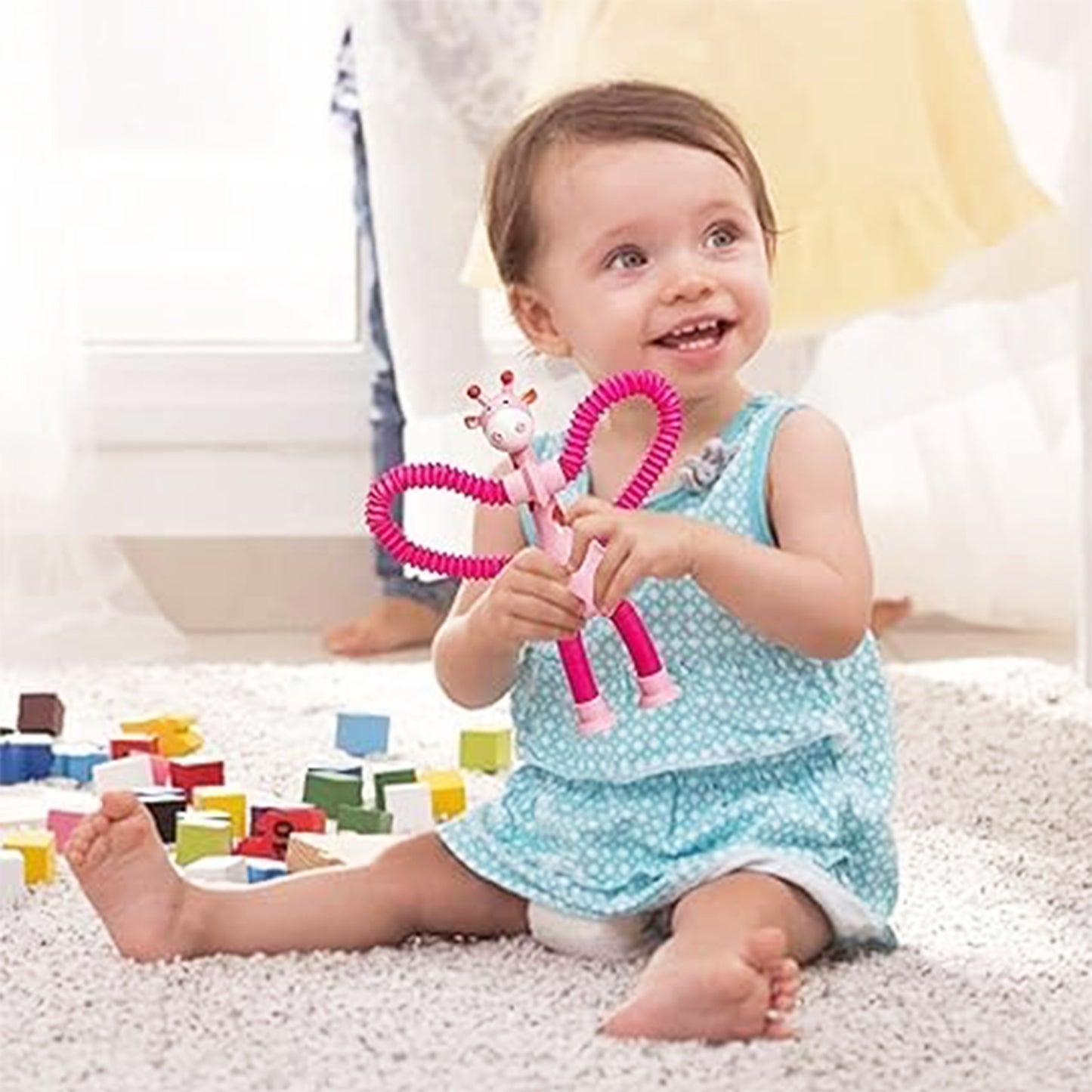 ToyBharat This Giraffe-Shaped Telescopic Suction Toy (Set of 1) is a fun, stretchy travel essential for toddlers. Safe, colorful, and easy to use—ideal for kids aged 1+ during flights, car rides, or at home.