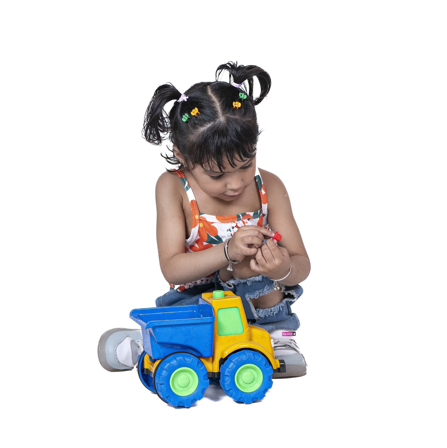 ToyBharat Mr Dumper Friction Toy Truck is a multicolour construction vehicle for kids aged 1-6 years. With a realistic design, it's a safe, durable, non-toxic gift toy for boys and girls for indoor outdoor play.
