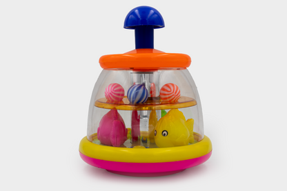 ToyBharat Push & Spin Fish & Ball Toy features a musical spinner with colorful fish and light-up balls. A multicolour interactive toy for toddlers that promotes learning through music, motion, and bright visuals.